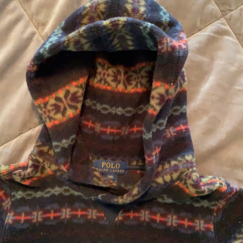 Over the head with hoodie, fleece long sleeve. It has a nice pattern, never worn